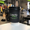 Custom printed biodegradable paper cup with black lid with 'Liberty Gym' logo